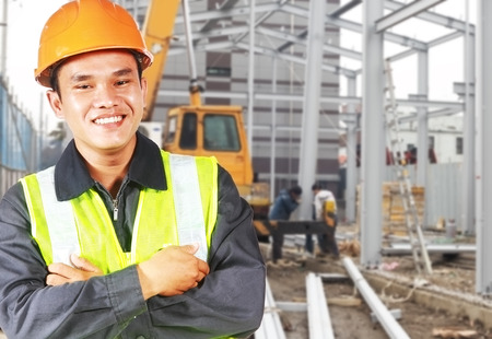  Builder construction worker or foreman with safety protective equipment  standing on  location siteの写真素材