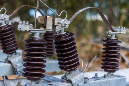 ceramic insulators on high tension power linesの写真素材