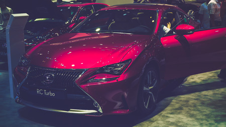 HO CHI MINH / VIETNAM, 04 AUG 2017 - Beauty Model and Lexus RC Turbo car on display at Vietnam motor Show 2017のeditorial素材