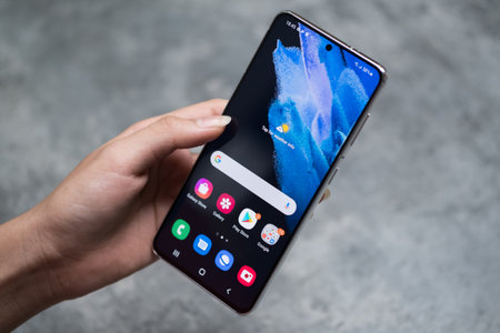 Woman hand holding iPhone X with Instagram application on the screenのeditorial素材