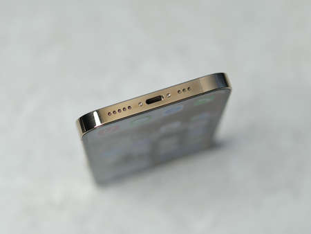 HCMC, Vietnam - August 19, 2021: View of new iPhone 13 or iPhone 13 Pro and Apple Airpods for editorial useのeditorial素材