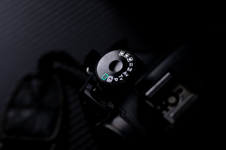 Close up of a DSLR camera on black background. Selective focus.のeditorial素材