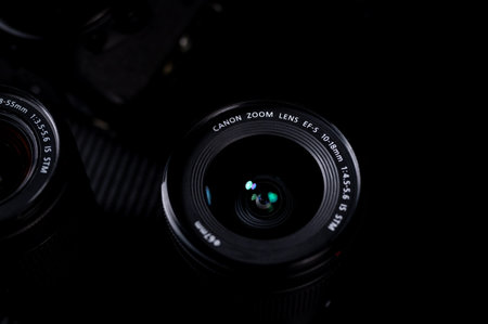 Camera lens on black background. Close-up. Shallow depth of fieldのeditorial素材