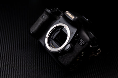 london, england, 05/05/2018 A retro film SLR camera isolated on a black background.のeditorial素材