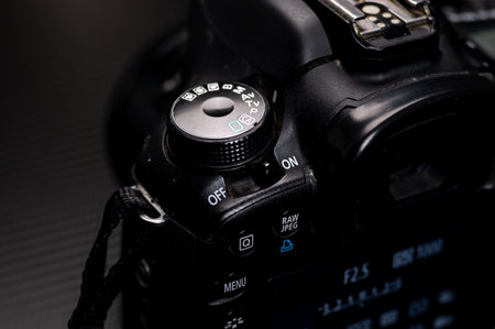 Close-up of a digital SLR camera on a black backgroundのeditorial素材