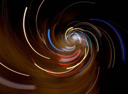 Abstract city lights composition: taken from aerial view of a night crossroad by fast camera...