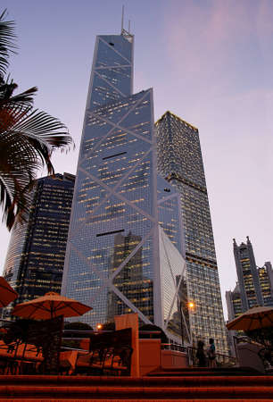 View of Hong Kong business district: bank and corporation skyscrapers at twilight.