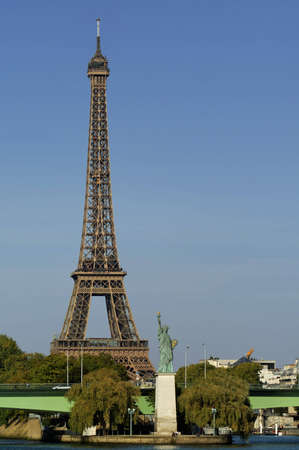 The small Statue of Liberty near the Eiffel tower in Paris, as seen from opposite bankの写真素材