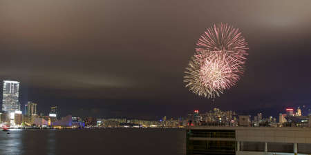 HONG KONG - JANUARY 24: fireworks on the Victoria Harbor celebrate the Chinese New Year (year of the dragon) on January 24, 2012 in Hong Kong. のeditorial素材