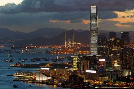 View of Tsim Sha Tsui in Hong Kong on a clear sunset evening の写真素材
