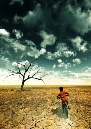 A global warming illustration with a boy drive a bike in desert.の写真素材