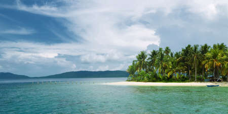Pure beautiful and natural beach with white sand, blue greenish water and beautiful sky. This picture taken in one of the most beautiful travel and diving destination on earth. Raja Ampat Island, Papua, Indonesia.の写真素材