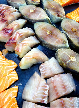 Frozen fish meat as a source of healthy protein on natural food markets displayの写真素材