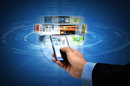 Businessman browsing through websites on his smart phone internet connectionの写真素材