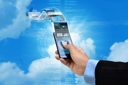 Businessman browsing through websites on his smart phone internet connectionの写真素材