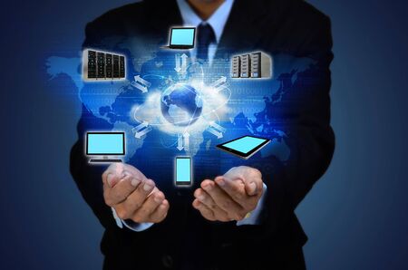 Internet for business conceptual image. Businessman using internet information technology to communicate and access global information.の写真素材