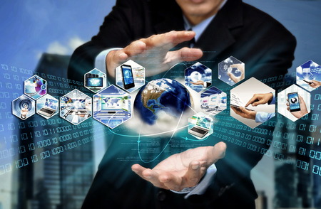 Internet for business conceptual image. Businessman using internet information technology to communicate and access global information.の写真素材