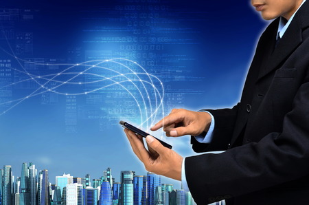 Internet for business conceptual image. Businessman using internet information technology to communicate and access global information.の写真素材