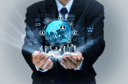 Businessman showing a virtual display of internet business network on his handの写真素材