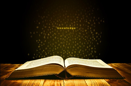 Book of Knoweldgewith golden aura and letters flies from the pages