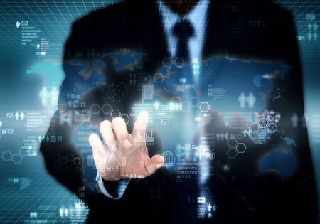 Businessman accessing internet information on  virtual screenの写真素材