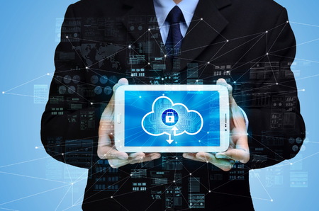 Businessman showing secured  internet cloud technology concept for storage and backupの写真素材