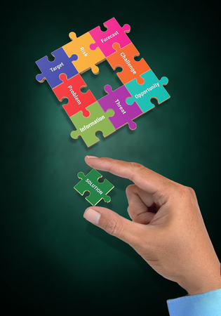 Conceptual images of business situation and use the solution to fix problem with puzzle visualization.の写真素材