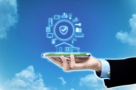 Internet of things and smart home concept. Controlling everything with a smart phone or gadget using application.の写真素材
