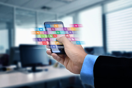 Internet concept. Businessman using a smart phone to browse or use application on lineの写真素材