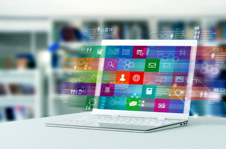 a laptop computer shows a process of browsing application and multimedia content on internet. Mixed...