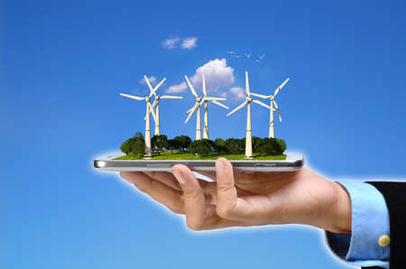 Wind Turbines Green Energy. Wind turbines plantation a smart phone . 3D Rendered image.の写真素材