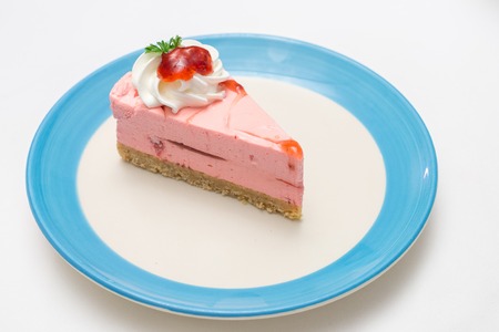 strawberry mousse cake with whipped cream toppingの写真素材