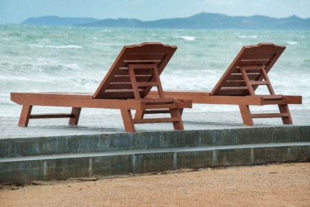 Two wooden beach chairsの写真素材