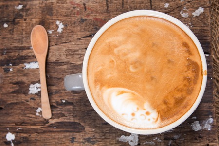 Cup of Cappuchino on wooden decolativeの写真素材