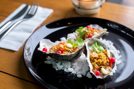 Oysters with spicy thai herbの写真素材