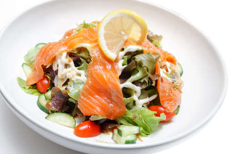 Salmon salad on white tableの写真素材