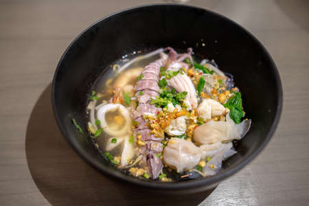 Thai Tom Yum spicy lime seafood noodle with mantis shrimpの写真素材