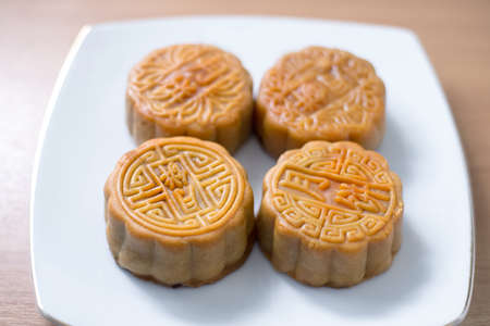 4 moon cakes in a Chinese mid-autumn festival on white plate
