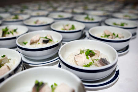Row of Bowl boiled rice with fish fillet