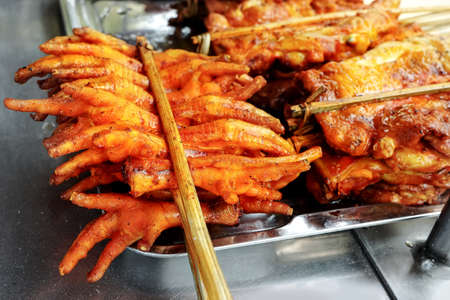 Thai street food skewer chicken Grilled chicken feetの写真素材