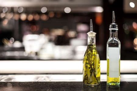 Healthy olive oil bottles in kitchenの写真素材