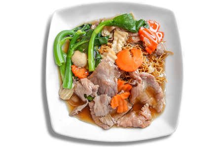 Fried egg noodle topped with meat red gravy in top view isolated on white background - Rad Na Thai food in chinese restaurantの写真素材