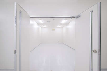 Perspective of empty warehouse store room with door openの写真素材