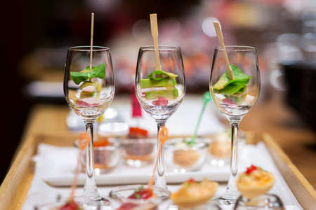 canape glasses on wooden slate platter