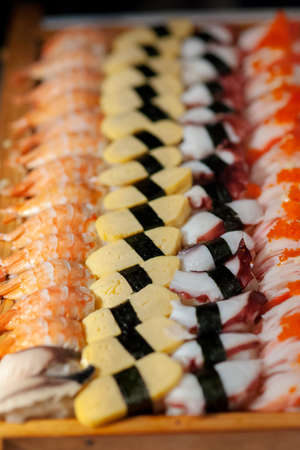 Tray of assortment of Japanese nigiri sushiの写真素材