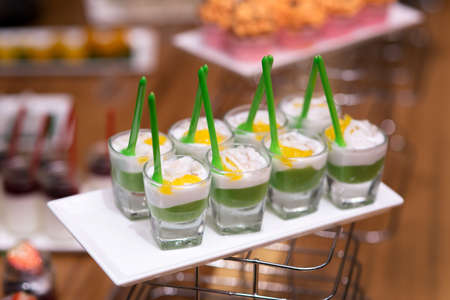 Thai dessert on slate platter - Ta Koh - Ta Koh is pudding topped with coconut milkの写真素材