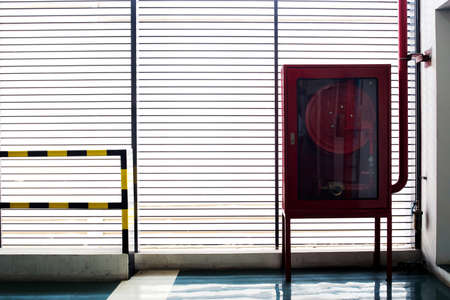 Hydrant with water hoses and fire extinguish equipmentの写真素材