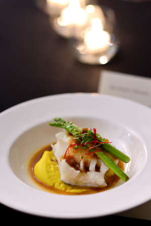 Fine dining restaurant - fish steak on mash potatoの写真素材
