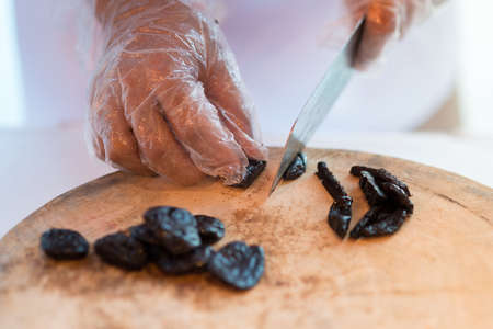 Chef cutting on wooden board