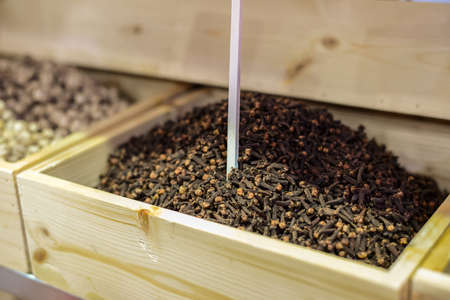 Cloves in wooden box - the herb that have many benefit sush as , for healing sickness , making food , or in medical wayの写真素材